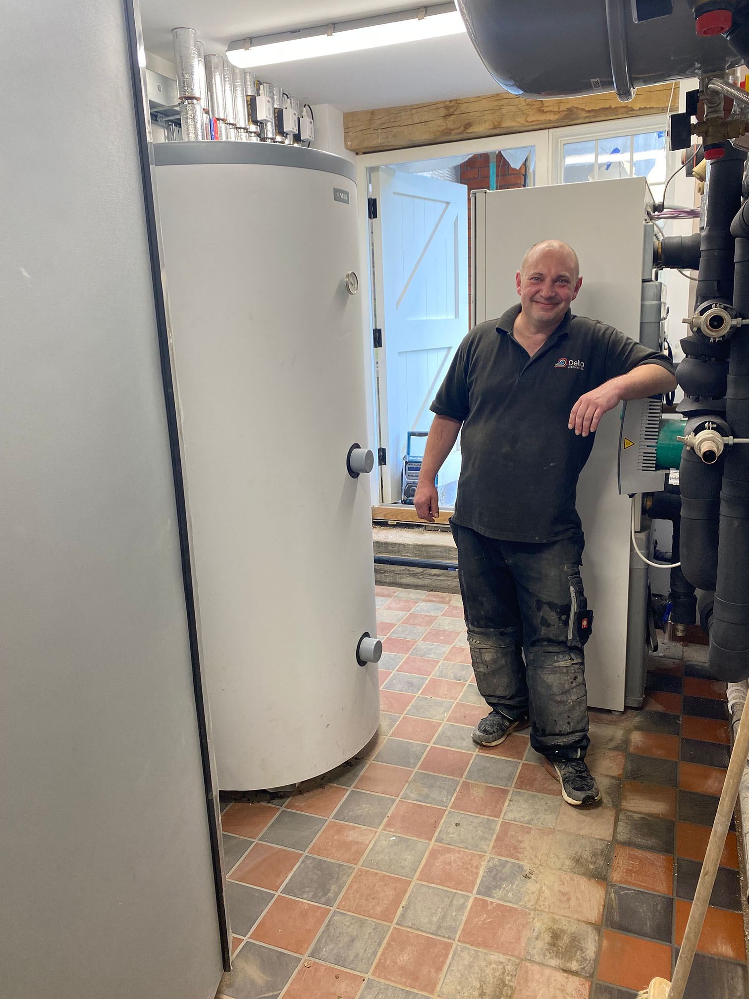 Will Blair standing next to his heat pump installation